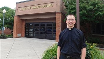 Diocesan priest, in full PPE, visits residents at Teresian House 