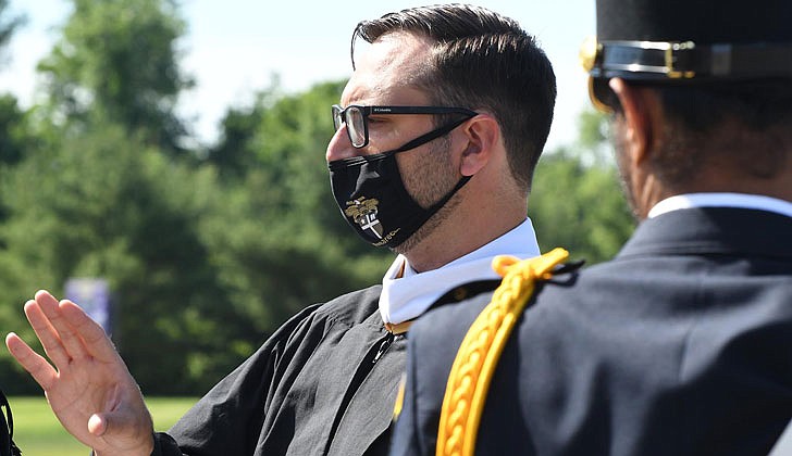 Scenes from Christian Brothers Academy’s graduation at the football stadium on Thursday in which 88 Cadets graduated.  Matt Agan, social studies teacher, during the graduation.  (Photos by Michael P. Farrell)