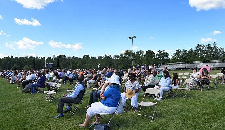 Scenes from Christian Brothers Academy’s graduation at the football stadium on Thursday.   Family and friends watch the ceremony.  (Photos by Michael P. Farrell)