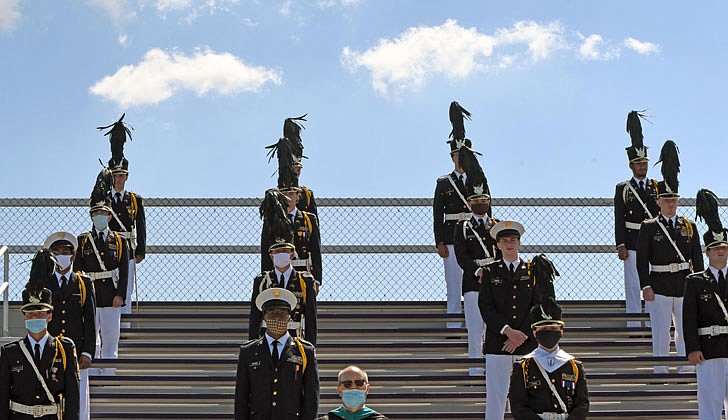 Scenes from Christian Brothers Academy’s graduation at the football stadium on Thursday in which 88 seniors graduated.  The seniors stand at attention.  (Photos by Michael P. Farrell)