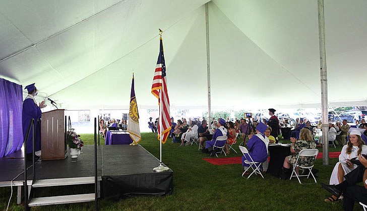 Catholic Central High School in Troy held its 97th Commencement Exercises on Saturday, July 25, under a tent at the athletic fields. The school graduated 40 seniors, including Valedictorian Paul Barber and Salutatorian Michael J. Paglia. Bishop Edward B. Scharfenberger presided and blessed the graduates.  Graduate Paul Barnas welcomes friends and families.  Photos by Michael P. Farrell 