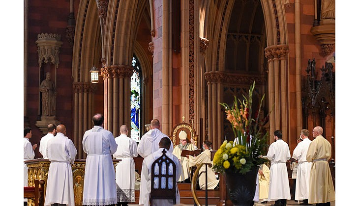 The combined Priesthood Ordination Rite and Diaconate Ordination Rite was celebrated by Bishop Edward B. Scharfenberger, with one man ordained to the priesthood and 13 men ordained to the Diaconate - eight men to the Permanent Diaconate and five men to the Transitional Diaconate - on Sept. 5 at the Cathedral of the Immaculate Conception in Albany.   The deacon-elects rise and stand before Bishop Scharfenberger, who questions them and concludes with the Promise of Obedience.  Photos by Cindy Schultz 