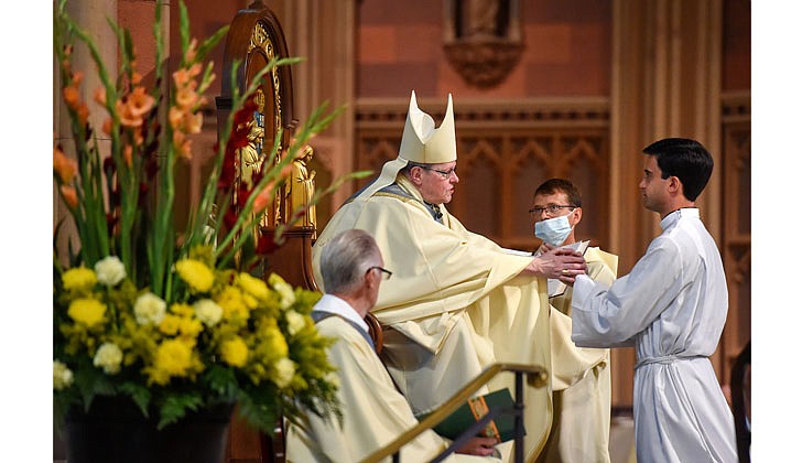 The combined Priesthood Ordination Rite and Diaconate Ordination Rite was celebrated by Bishop Edward B. Scharfenberger, with one man ordained to the priesthood and 13 men ordained to the Diaconate - eight men to the Permanent Diaconate and five men to the Transitional Diaconate - on Sept. 5 at the Cathedral of the Immaculate Conception in Albany.   Bishop Scharfenberger receives each deacon-elect.  Photos by Cindy Schultz 