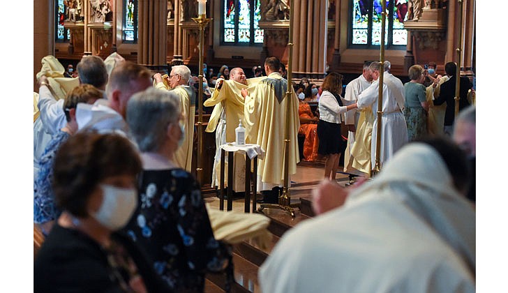 The combined Priesthood Ordination Rite and Diaconate Ordination Rite was celebrated by Bishop Edward B. Scharfenberger, with one man ordained to the priesthood and 13 men ordained to the Diaconate - eight men to the Permanent Diaconate and five men to the Transitional Diaconate - on Sept. 5 at the Cathedral of the Immaculate Conception in Albany.   As a group, the 13 newly-ordained deacons are vested with stole and dalmatic.  Photos by Cindy Schultz 