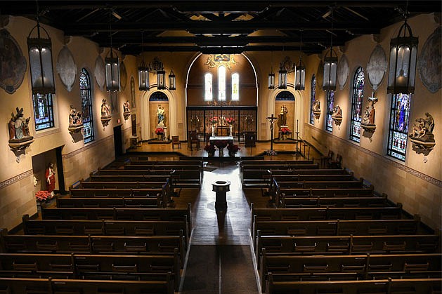 St. Anthony’s Church in Schenectady restoration includes: a Eucharistic reservation chapel with a movable wrought-iron screen decorated with gilded Eucharistic symbols, wheat and grapes; and a refurbished sanctuary with all new stained glass. (Cindy Schultz photos)