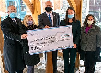 Trustco donates $13.5K to Catholic Charities  