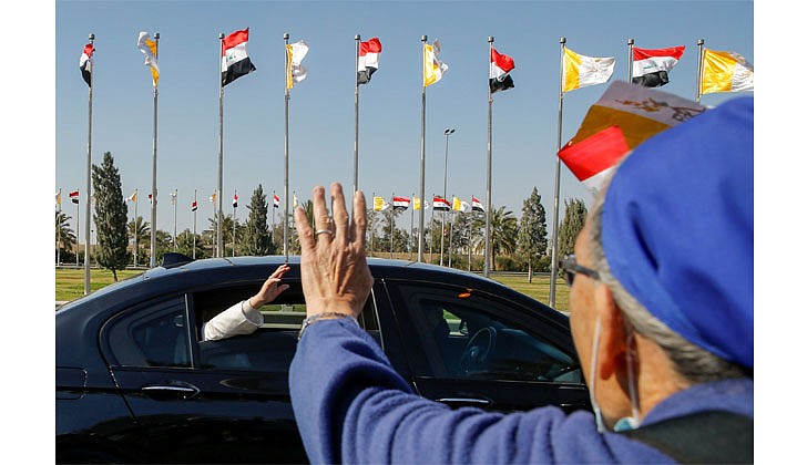 Pope Francis arrived in Baghdad, Iraq on Friday for his historic four-day visit to the Middle East nation. It is the first time a pope has ever visited Iraq and Pope Francis’ first foreign trip in 15 months because of the COVID-19 pandemic. The visit was to promote peace, tolerance and equality in the troubled nation.   Caption: Pope Francis waves to people from his car as he arrives in Baghdad on March 5. (CNS photo/Thaier Al-Sudani, Reuters)