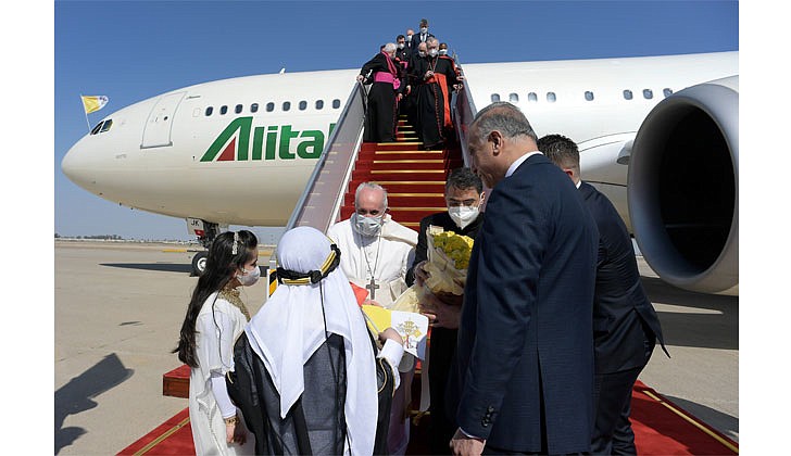 Pope Francis arrived in Baghdad, Iraq on Friday for his historic four-day visit to the Middle East nation. It is the first time a pope has ever visited Iraq and Pope Francis’ first foreign trip in 15 months because of the COVID-19 pandemic. The visit was to promote peace, tolerance and equality in the troubled nation.   Caption: Pope Francis is greeted by children as arrives at Baghdad International Airport on March 5. (CNS photo/Vatican Media via Reuters)