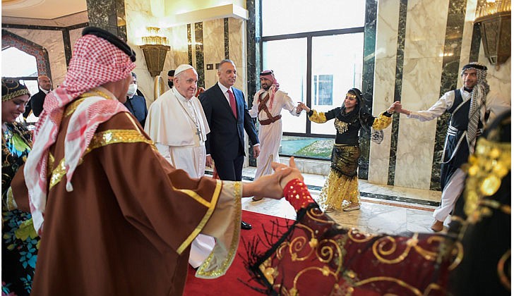 Pope Francis arrived in Baghdad, Iraq on Friday for his historic four-day visit to the Middle East nation. It is the first time a pope has ever visited Iraq and Pope Francis’ first foreign trip in 15 months because of the COVID-19 pandemic. The visit was to promote peace, tolerance and equality in the troubled nation.   Caption: Pope Francis walks alongside Iraqi Prime Minister Mustafa al-Kadhimi as he arrives at Baghdad International Airport on March 5. (CNS photo/Vatican Media)