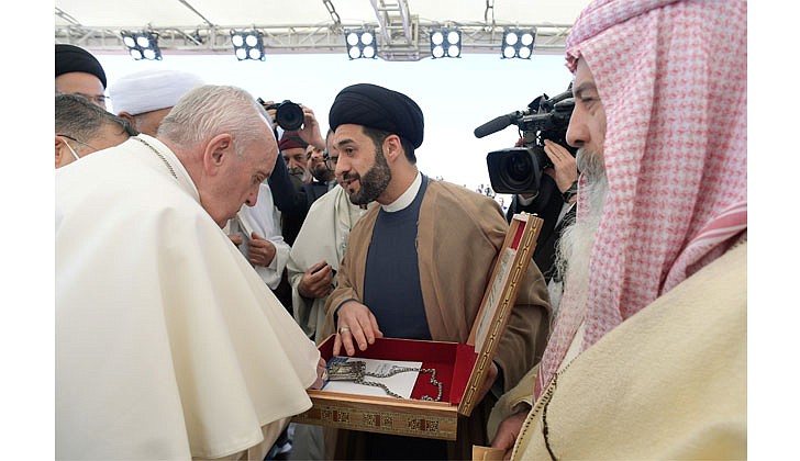 Pope Francis receives a gift during an interreligious meeting on the plain of Ur near Nasiriyah, Iraq, March 6, 2021. (CNS photo/Vatican Media)