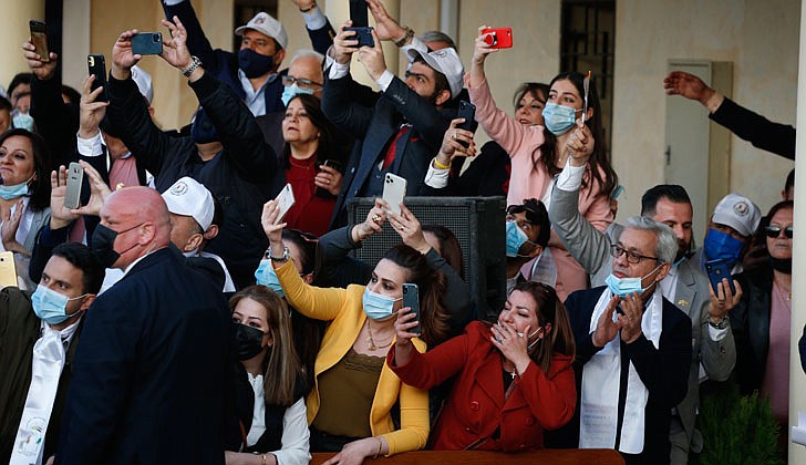 People cheer as Pope Francis arrives to celebrate Mass at St. Joseph Chaldean Catholic Cathedral in Baghdad March 6, 2021. (CNS photo/Paul Haring)