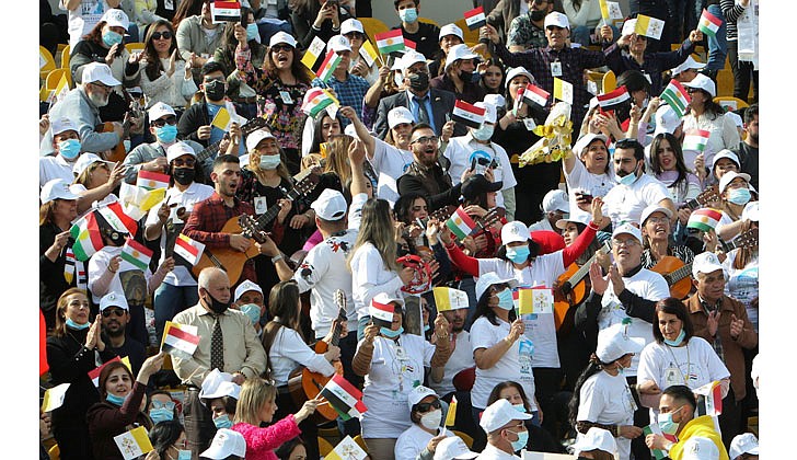 People sing and cheer as they wait for Pope Francis to celebrate Mass at Franso Hariri Stadium in Irbil, Iraq, March 7, 2021. (CNS photo/Azad Lashkari, Reuters)