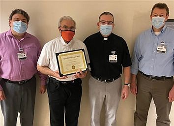 Father Carlino wins COVID Super Hero Award