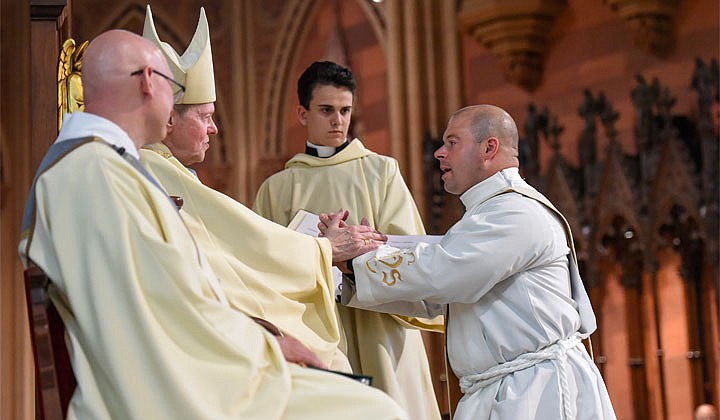 Deacons Matthew Duclos, Kyle Gorenski, Daniel McHale, Nathaniel Resila and Stephen Yusko were ordained into the priesthood at the Cathedral of the Immaculate Conception in Albany by Bishop Edward B. Scharfenberger on June 19.   Deacon Kyle Gorenski gives the promise of obedience to Bishop Edward B. Scharfenberger during Mass.  Photos by Cindy Schultz  