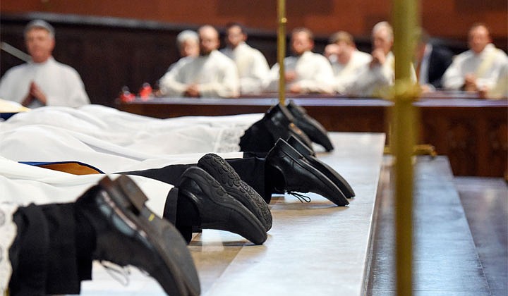 Deacons Matthew Duclos, Kyle Gorenski, Daniel McHale, Nathaniel Resila and Stephen Yusko were ordained into the priesthood at the Cathedral of the Immaculate Conception in Albany by Bishop Edward B. Scharfenberger on June 19.   The candidates for the Ordination to the Priesthood lay in supplication.  Photos by Cindy Schultz  