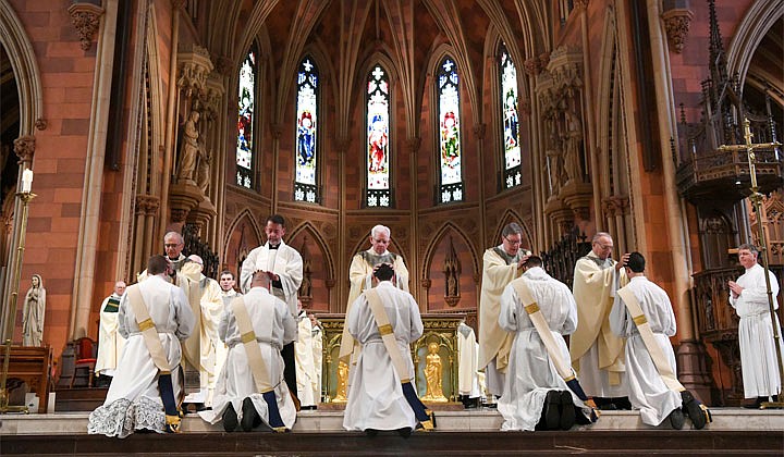 Deacons Matthew Duclos, Kyle Gorenski, Daniel McHale, Nathaniel Resila and Stephen Yusko were ordained into the priesthood at the Cathedral of the Immaculate Conception in Albany by Bishop Edward B. Scharfenberger on June 19.   Priests lay their hands upon the candidates.  Photos by Cindy Schultz  