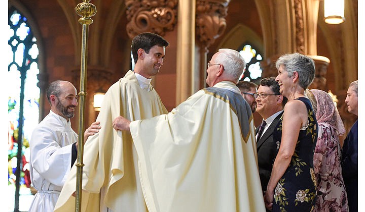 Deacons Matthew Duclos, Kyle Gorenski, Daniel McHale, Nathaniel Resila and Stephen Yusko were ordained into the priesthood at the Cathedral of the Immaculate Conception in Albany by Bishop Edward B. Scharfenberger on June 19.   Newly-ordained priest Matthew Duclos (c.) is vested with stole and chasuble.  Photos by Cindy Schultz  