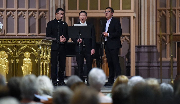 The Diocese of Albany held its seventh annual Concert for Vocations at the Cathedral of the Immaculate Conception in Albany on Aug. 3. Following Holy Hour and Benediction, Bishop Edward B. Scharfenberger, along with priests, deacons, religious discerners and laity, performed during the concert which mixed classic and contemporary music. Bishop Scharfenberger performed “The Impossible Dream” from Man of La Mancha as well as "Fratello Sole, Sorella Luna" (Brother Sun, Sister Moon). To watch the concert, head to rcda.org.  Caption: Joseph Tuan Cao, Joseph Tuan Pham and Dominic Tuyen Nguyen sing a Vietnamese song that translates to mean “God calls my name.”   Photos by Cindy Schultz