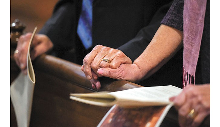 Ray Germain and Joanne McKeon, who have been married five years, renew their vows along with all the attending couples during the 49th Annual Diocesan Marriage Jubilee on Oct. 30 at the Cathedral of the Immaculate Conception in Albany. (Cindy Schultz for The Evangelist)