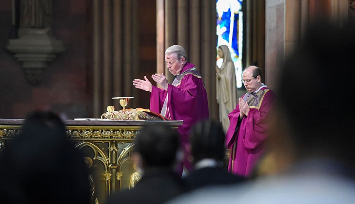 Parishes throughout the Diocese of Albany observed Ash Wednesday, March 2, as “A Day of Prayer and Fasting for Peace in Ukraine,” as requested by Pope Francis. Ash Wednesday marks the start of Lent, beginning a period of prayer and fasting, culminating with Holy Week and Easter Sunday, April 17. Bishop Edward B. Scharfenberger celebrated Mass and distributed ashes at the Cathedral of the Immaculate Conception that day. Bishop Scharfenberger continues to urge Catholics to support emergency relief for Ukraine as the humanitarian crisis grows. Catholic Relief Services is working with its partner, Caritas Ukraine, to respond. Use this link to help:https://bit.ly/3hbagDJ. The Knights of Columbus also have established the Ukraine Solidarity Fund and you can donate at: kofc.org/secure/en/donate/ukraine.html.  In the photo: Bishop Scharfenberger blesses the Eucharistic gifts during Mass.  Cindy Schultz photo for The Evangelist.