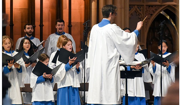 Bishop Edward B. Scharfenberger celebrated Easter Sunday Mass at the Cathedral of the Immaculate Conception in Albay on April 17. Here is a pictorial look back!  Caption: Music Director Timothy Reno leads the choir in song.  Photos by Cindy Schultz