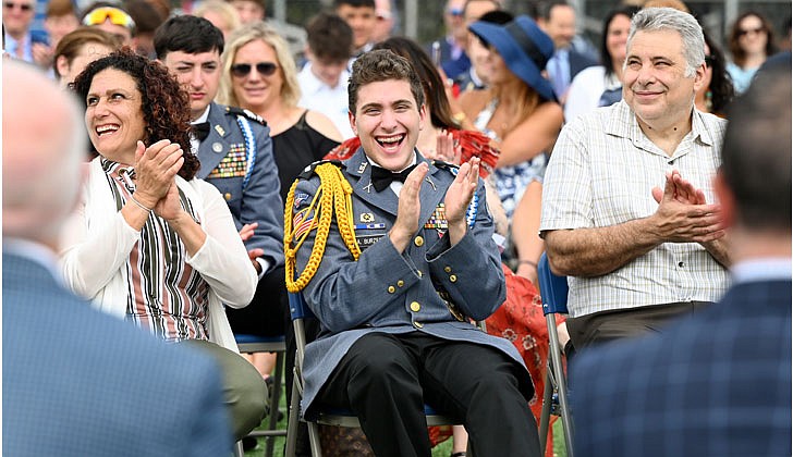 La Salle Institute honored its graduating class of 2022 — the last all-male class — with a formal, in-person commencement ceremony May 14 on the school’s athletic field. The ceremony featured John Thero ’79, former president and CEO of Amarin Corporation, as guest speaker. “I am exceptionally proud of this group of young men. They have conquered challenges and persevered despite unprecedented challenges, and they have proven to be extraordinary,” said La Salle Institute President and Head of School Joseph Raczkowski ’72. “They will attend college this fall at Notre Dame, Cornell University, UNC-Chapel Hill and The Citadel, to name a few. 18 young men will continue their athletic careers in college, including four at the Division 1 level. To say I am proud is an understatement, and I have no doubt they will go on to have great success in college and life.” Members of the class of 2022 were accepted to 141 colleges and universities in 28 states and the District of Columbia and earned more than $12.4 million in scholarships. In October 2020, La Salle announced its Mission Expansion Initiative, a shift to a co-educational model which began in September 2021.  Cadet Colonel Angelo Burzesi, who received the award for The Commander of the Cadet Brigade, laughs at a funny moment during the ceremony.  Cindy Schultz photos for The Evangelist