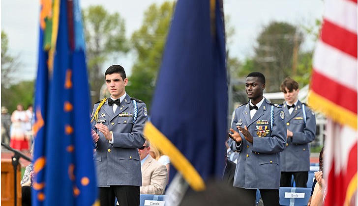 La Salle Institute honored its graduating class of 2022 — the last all-male class — with a formal, in-person commencement ceremony May 14 on the school’s athletic field. The ceremony featured John Thero ’79, former president and CEO of Amarin Corporation, as guest speaker. “I am exceptionally proud of this group of young men. They have conquered challenges and persevered despite unprecedented challenges, and they have proven to be extraordinary,” said La Salle Institute President and Head of School Joseph Raczkowski ’72. “They will attend college this fall at Notre Dame, Cornell University, UNC-Chapel Hill and The Citadel, to name a few. 18 young men will continue their athletic careers in college, including four at the Division 1 level. To say I am proud is an understatement, and I have no doubt they will go on to have great success in college and life.” Members of the class of 2022 were accepted to 141 colleges and universities in 28 states and the District of Columbia and earned more than $12.4 million in scholarships. In October 2020, La Salle announced its Mission Expansion Initiative, a shift to a co-educational model which began in September 2021.  Graduates, including salutatorian Ryan Ciancio (l.) and Dominic Brefo Jr. (c.), stand as they are recognized during commencement exercises.  Cindy Schultz photos for The Evangelist