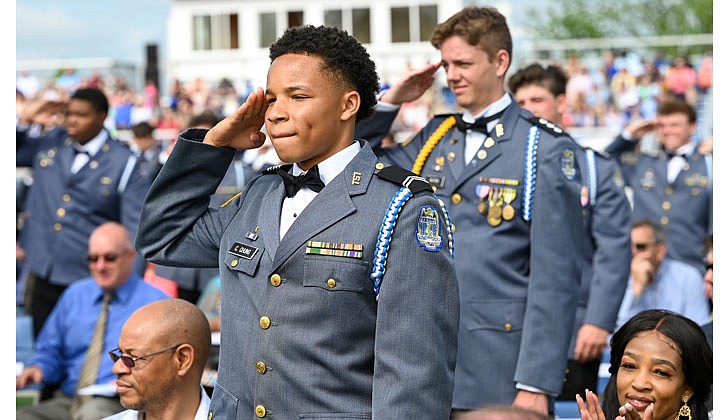 La Salle Institute honored its graduating class of 2022 — the last all-male class — with a formal, in-person commencement ceremony May 14 on the school’s athletic field. The ceremony featured John Thero ’79, former president and CEO of Amarin Corporation, as guest speaker. “I am exceptionally proud of this group of young men. They have conquered challenges and persevered despite unprecedented challenges, and they have proven to be extraordinary,” said La Salle Institute President and Head of School Joseph Raczkowski ’72. “They will attend college this fall at Notre Dame, Cornell University, UNC-Chapel Hill and The Citadel, to name a few. 18 young men will continue their athletic careers in college, including four at the Division 1 level. To say I am proud is an understatement, and I have no doubt they will go on to have great success in college and life.” Members of the class of 2022 were accepted to 141 colleges and universities in 28 states and the District of Columbia and earned more than $12.4 million in scholarships. In October 2020, La Salle announced its Mission Expansion Initiative, a shift to a co-educational model which began in September 2021.  Chrischen Chung (c.) stands with fellow graduates as they salute their teachers.  Cindy Schultz photos for The Evangelist