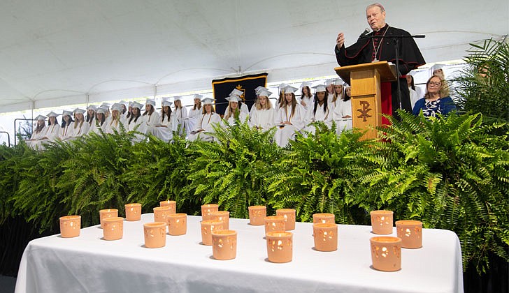 The Academy of the Holy Names celebrated its 133rd commencement ceremony on May 27 with Bishop Edward B. Scharfenberger presiding. 100 percent of the 44 graduating seniors were accepted into colleges and universities which included Cornell, Dartmouth, Fordham, Holy Cross, Villanova and Notre Dame. They also received a total $18.4 million in merit-based scholarships. Over the last four years, the seniors also performed 2,485 hours of community service.  Bishop Scharfenberger speaks to those in attendance as 21 candles are lit to remember those killed in the Uvalde, Texas, school shooting.  Patrick Dodson photos for The Evangelist
