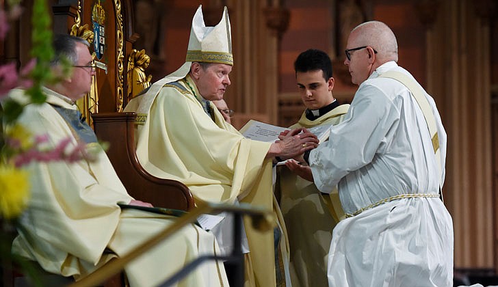 Calling the priesthood “a ministry of love,” Bishop Edward B. Scharfenberger of the Diocese of Albany presided over the Ordination to the Priesthood of Father Russell Bergman and Father James O’Rourke - who were both profiled in last week’s The Evangelist - on June 18 at the Cathedral of the Immaculate Conception in Albany.  Father O’Rourke celebrated his first Mass at Blessed Sacrament in Albany on June 19, while Father Bergman celebrated his first Mass at Our Lady of Victory in Troy.  Father Bergman said of his ordination: “It was beyond comparison to any experience I’ve had in my life. An awesome experience in the true divine sense of awesome, full of humility, joy, wonder, intensity, thanksgiving, fulfillment and palpable love, among so many other feelings that words alone cannot capture.”   The parish assignments for both priests are expected to be announced on June 27.  Bishop Edward B. Scharfenberger questions Deacon James O’Rourke, who gives him his Promise of Obedience.  Cindy Schultz photos for The Evangelist.  