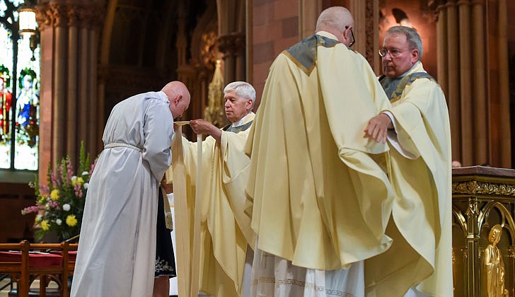 Calling the priesthood “a ministry of love,” Bishop Edward B. Scharfenberger of the Diocese of Albany presided over the Ordination to the Priesthood of Father Russell Bergman and Father James O’Rourke - who were both profiled in last week’s The Evangelist - on June 18 at the Cathedral of the Immaculate Conception in Albany.  Father O’Rourke celebrated his first Mass at Blessed Sacrament in Albany on June 19, while Father Bergman celebrated his first Mass at Our Lady of Victory in Troy.  Father Bergman said of his ordination: “It was beyond comparison to any experience I’ve had in my life. An awesome experience in the true divine sense of awesome, full of humility, joy, wonder, intensity, thanksgiving, fulfillment and palpable love, among so many other feelings that words alone cannot capture.”   The parish assignments for both priests are expected to be announced on June 27.  Newly ordained priests, Father Russell Bergman (l.) and Father James O’Rourke, are vested with stole and chasuble.  Cindy Schultz photos for The Evangelist.  