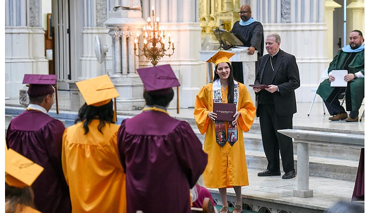 Notre Dame-Bishop Gibbons School held its Commencement Ceremony on June 25 at St. John the Evangelist Church in Schenectady. With a 100 percent graduation rate, the 33 seniors received over $8 million dollars in scholarships and grants for college over four years. In addition, they were accepted into 65 colleges and universities in 12 states and 20 New York counties.   Graduate Amelia Civitello poses for a photo after receiving her diploma.  Cindy Schultz photos for The Evangelist