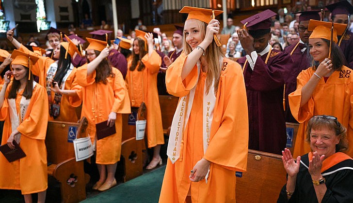 Notre Dame-Bishop Gibbons School held its Commencement Ceremony on June 25 at St. John the Evangelist Church in Schenectady. With a 100 percent graduation rate, the 33 seniors received over $8 million dollars in scholarships and grants for college over four years. In addition, they were accepted into 65 colleges and universities in 12 states and 20 New York counties.   NDBG Valedictorian Victoria Jaworowski (c.) joins her classmates as they turn their tassels to the left to show they’ve graduated.  Cindy Schultz photos for The Evangelist