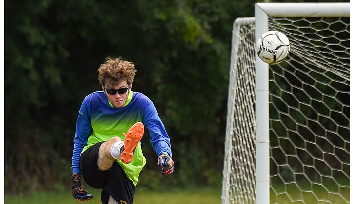 Saratoga Central Catholic keeper Matthew Murphy kicks the ball out of harm's way. (Cindy Schultz photo for The Evangelist)