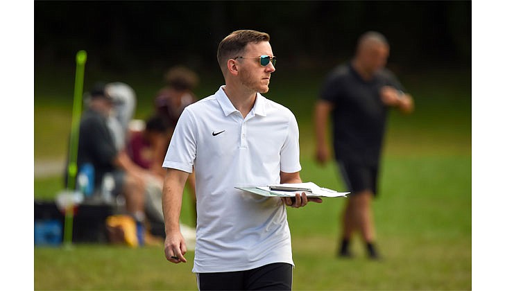 Saratoga Central Catholic coach Jeff Pompa walks the sidelines during his team's 2-0 loss to Notre Dame-Bishop Gibbons on Sept. 3. (Cindy Schultz photo for The Evangelist)