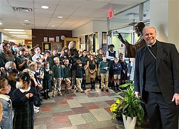 Bishop blesses Jesus statue at St. Thomas the Apostle School