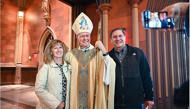 The 50th Annual Diocesan Marriage Jubilee Celebration, sponsored by the Office of Lay Ministry and Parish Faith Formation, was held at the Cathedral of the Immaculate Conception in Albany on Oct. 8.  Bishop Edward B. Scharfenberger poses for a picture with Barbara and Michael Krok, who’ve been married for 40 years, following the 50th Diocesan Marriage Jubilee Mass at the Cathedral of Immaculate Conception in Albany.  Photos by Cindy Schultz for The Evangelist 