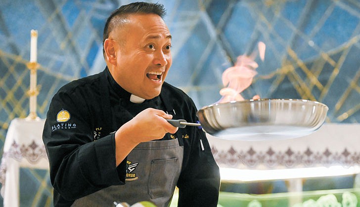 Father Leo Patalinghug, who is a priest, show host and award-winning cook, prepares pasta alla vodka during a special service on March 30 at St. Clement’s Church in Saratoga Springs.    Cindy Schultz photo for The Evangelist