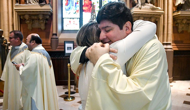 Deacon Daniel Vallejo Rios embraces his aunt, Ana Valbuena, after his Ordination to the Diaconate on May 21 at the Cathedral of the Immaculate Conception in Albany.    Cindy Schultz photo for The Evangelist