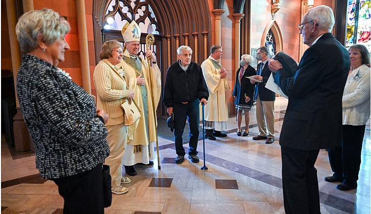 Bishop Scharfenberger greets couples and takes photo with them after the 50th Diocesan Marriage Jubilee Mass at the Cathedral of the Immaculate Conception in Albany on Oct. 8.  Cindy Schultz photo for The Evangelist