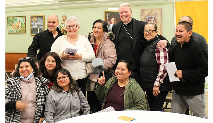 Bishop Edward B. Scharfenberger is all smiles as he poses with participants during the first Diocesan Synod Listening Session, which took place on April 20 at Holy Trinity Church in Johnstown.  Molly Halpin photo