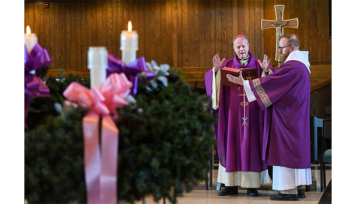 Bishop Edward B. Scharfenberger celebrates Mass during the Unleashing Love Women's Retreat, which was held at St. Pius X Church in Loudonville on Dec. 10.  Cindy Schultz photo for The Evangelist