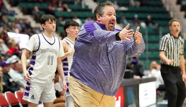 The Catholic Central boys’ basketball team made history on March 4 by defeating Glens Falls, 73-59, in the Section II Class B final at Cool Insuring Arena in Glens Falls for the program’s first section crown since 1981. The Crusaders were led by freshmen Darien Moore, who had 27 points and 13 rebounds and was named MVP of the tournament, and Sei’Mir Roberson, who added 21 points and earned all-tournament team honors.  The win was especially sweet for the young Crusaders who suffered a heart-breaking 51-50 loss to Ichabod Crane in last year’s finals. The rest of the Crusaders, who are led by coach Guy DiBacco, are freshman Xaul Arroyo, senior Conor Gemmill, freshman Qwameik Smith, eighth-grader Xavjon Arroyo, senior Nick Schrom, seventh-grader Aiden Prunty, senior Nick Riley, junior Danny Bologna and junior Brian Warncke.   Coach Guy DiBacco keeps an eye on the action.  Cindy Schultz photos for The Evangelist