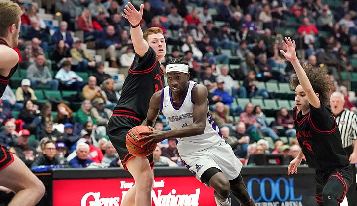 The Catholic Central boys’ basketball team made history on March 4 by defeating Glens Falls, 73-59, in the Section II Class B final at Cool Insuring Arena in Glens Falls for the program’s first section crown since 1981. The Crusaders were led by freshmen Darien Moore, who had 27 points and 13 rebounds and was named MVP of the tournament, and Sei’Mir Roberson, who added 21 points and earned all-tournament team honors.  The win was especially sweet for the young Crusaders who suffered a heart-breaking 51-50 loss to Ichabod Crane in last year’s finals. The rest of the Crusaders, who are led by coach Guy DiBacco, are freshman Xaul Arroyo, senior Conor Gemmill, freshman Qwameik Smith, eighth-grader Xavjon Arroyo, senior Nick Schrom, seventh-grader Aiden Prunty, senior Nick Riley, junior Danny Bologna and junior Brian Warncke.   Darien Moore heads to the basket against Glens Falls.  Cindy Schultz photos for The Evangelist