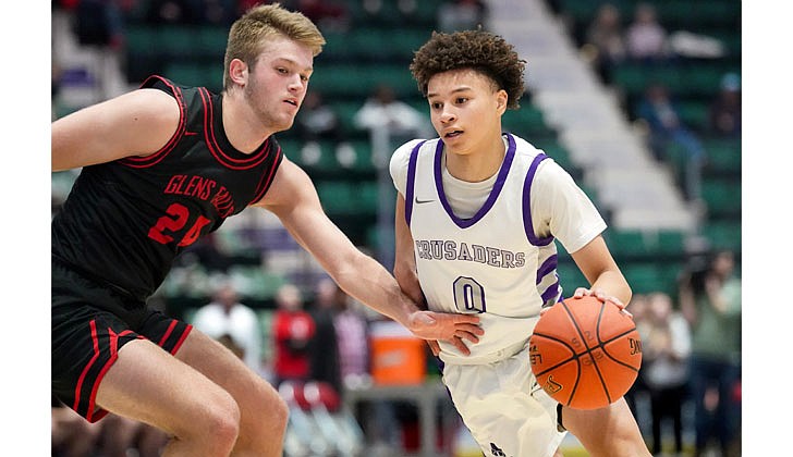 The Catholic Central boys’ basketball team made history on March 4 by defeating Glens Falls, 73-59, in the Section II Class B final at Cool Insuring Arena in Glens Falls for the program’s first section crown since 1981. The Crusaders were led by freshmen Darien Moore, who had 27 points and 13 rebounds and was named MVP of the tournament, and Sei’Mir Roberson, who added 21 points and earned all-tournament team honors.  The win was especially sweet for the young Crusaders who suffered a heart-breaking 51-50 loss to Ichabod Crane in last year’s finals. The rest of the Crusaders, who are led by coach Guy DiBacco, are freshman Xaul Arroyo, senior Conor Gemmill, freshman Qwameik Smith, eighth-grader Xavjon Arroyo, senior Nick Schrom, seventh-grader Aiden Prunty, senior Nick Riley, junior Danny Bologna and junior Brian Warncke.   Sei’Mir Roberson dribbles past a Glens Falls defender.  Cindy Schultz photos for The Evangelist