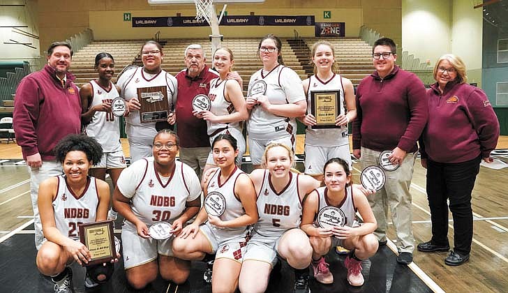 The Notre Dame-Bishop Gibbons girls’ basketball team defeated Hartford, 58-48, to win the Section II Class D championship on March 2 at Hudson Valley Community College.  "I am extremely proud of these young ladies for their heart, determination and most importantly their support of each other,” said NDBG coach Pat Moran, who was also named the school’s principal last week, in an email to The Evangelist.  “It has been a long season with ups and downs, but what has never changed is their willingness to never give up."  Junior Angie Deitz, who had 21 points and 11 rebounds, was named the tournament MVP for the second-seeded Golden Knights (14-7), and Mia Rose Wylie, who was named to the all-tournament squad, added 20. This is the first section title since 2019 for NDBG, which heads to the state regional final against the Section VII champ (Seton Catholic or Boquet Valley) on March 11.   The rest of the championship team includes: Molly Moran, Autumn Davis, Cora Jusino, Katie Al-Urrcon, Paige Moran, Tatum Liverio and Shuh-Kye Stuart.   In the photo: The Golden Knights celebrate their title.  Cindy Schultz photos for The Evangelist.