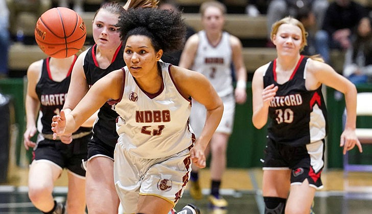 The Notre Dame-Bishop Gibbons girls’ basketball team defeated Hartford, 58-48, to win the Section II Class D championship on March 2 at Hudson Valley Community College.  "I am extremely proud of these young ladies for their heart, determination and most importantly their support of each other,” said NDBG coach Pat Moran, who was also named the school’s principal last week, in an email to The Evangelist. “It has been a long season with ups and downs, but what has never changed is their willingness to never give up."  Junior Angie Deitz, who had 21 points and 11 rebounds, was named the tournament MVP for the second-seeded Golden Knights (14-7), and Mia Rose Wylie, who was named to the all-tournament squad, added 20. This is the first section title since 2019 for NDBG, which heads to the state regional final against the Section VII champ (Seton Catholic or Boquet Valley) on March 11.   The rest of the championship team includes: Molly Moran, Autumn Davis, Cora Jusino, Katie Al-Urrcon, Paige Moran, Tatum Liverio and Shuh-Kye Stuart.   In the photo: Mia Rose Wylie outraces defenders for the basketball.  Cindy Schultz photos for The Evangelist. 