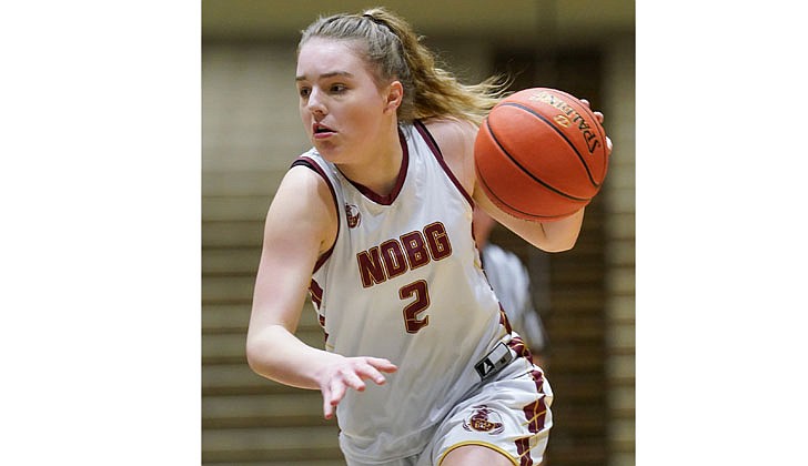 The Notre Dame-Bishop Gibbons girls’ basketball team defeated Hartford, 58-48, to win the Section II Class D championship on March 2 at Hudson Valley Community College.  "I am extremely proud of these young ladies for their heart, determination and most importantly their support of each other,” said NDBG coach Pat Moran, who was also named the school’s principal last week, in an email to The Evangelist. “It has been a long season with ups and downs, but what has never changed is their willingness to never give up."  Junior Angie Deitz, who had 21 points and 11 rebounds, was named the tournament MVP for the second-seeded Golden Knights (14-7), and Mia Rose Wylie, who was named to the all-tournament squad, added 20. This is the first section title since 2019 for NDBG, which heads to the state regional final against the Section VII champ (Seton Catholic or Boquet Valley) on March 11.   The rest of the championship team includes: Molly Moran, Autumn Davis, Cora Jusino, Katie Al-Urrcon, Paige Moran, Tatum Liverio and Shuh-Kye Stuart.   In the photo: Deitz controls the action against Harftord.  Cindy Schultz photos for The Evangelist. 