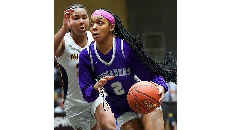 The Catholic Central girls’ basketball team lost to Averill Park, 61-49, in the Section II Class A championship at Hudson Valley Community College on March 3.  Sophomore Tanavia Turpin had a team-high 12 points for the Crusaders (19-3) and teammate El' Dior Dobere, an eighth-grader, added 11 points as both players made the all-tournament team. The rest of the team is made up of sophomore Meg Paul, senior Samantha Ayotte, freshman Gabriella DiBacco, senior Angelena Guiliano, freshman Akarri Gaddy and sophomore Brooklyn Moore.   In the photo: Turpin dribbles around Averill Park’s Tatiana Tune.   Cindy Schultz photos for The Evangelist. 