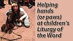 Therapy dogs help children relax at Liturgy of the Word